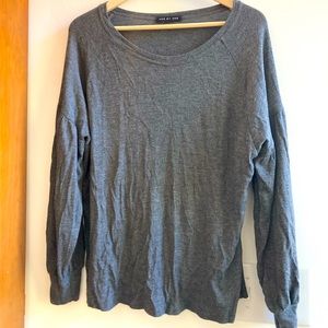 One by One gray thermal knit sweater with bishop sleeves.